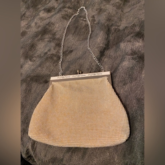 Elegant Cream and Silver Wristlet with Textured Finish